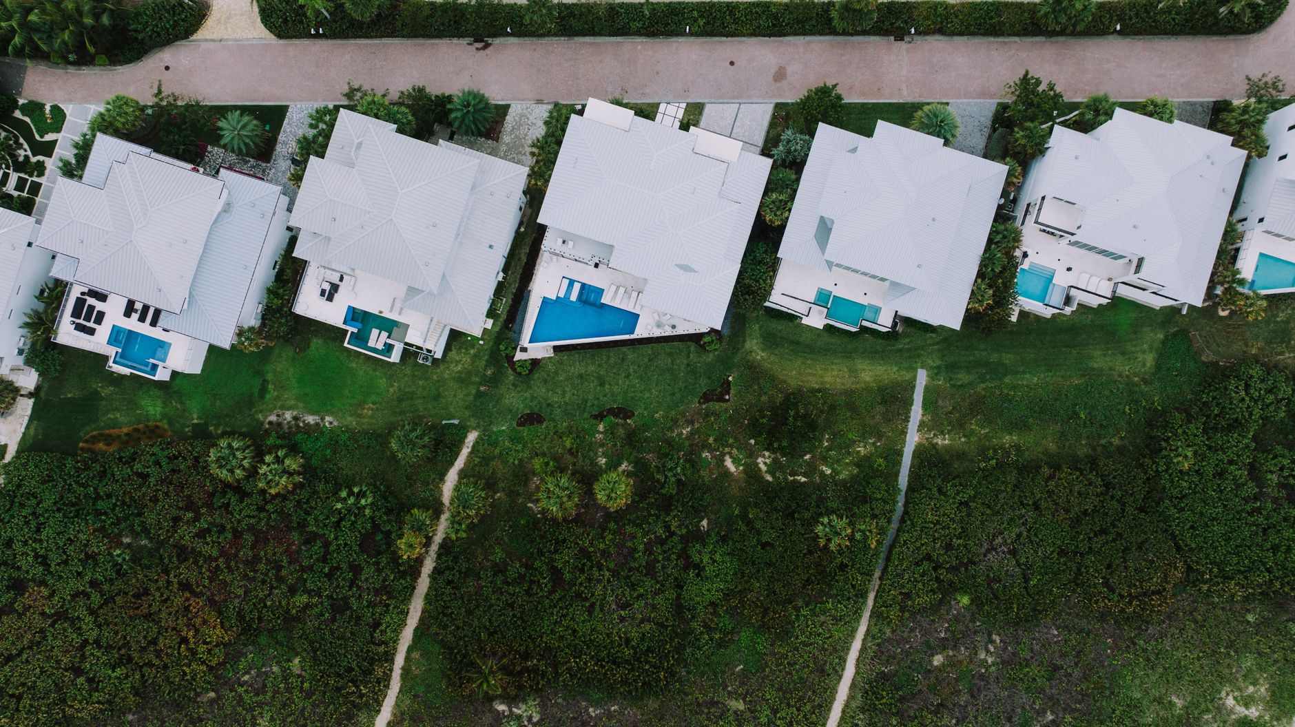 Aerial view of a Port Charlotte neighborhood with pools